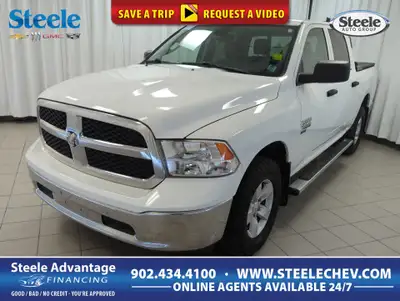 Drive our 2022 RAM 1500 Classic Tradesman Crew Cab 4X4 in Bright White and start taking care of busi...