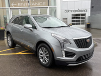 The 2023 Cadillac XT5, finished in a sleek Argent Silver Metallic paint, offers a confident all-whee... (image 9)