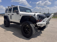 2013 Jeep Wrangler Unlimited Sahara 4x4 for sale at Pacific Motors near Winnipeg, MB DISCLAIMER: THI... (image 2)
