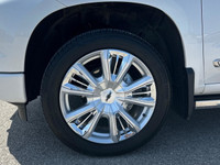 The Chevrolet Silverado 1500 High Country in pristine white with a robust 4×4 drivetrain ensures exc... (image 4)