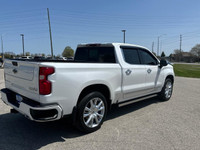 The Chevrolet Silverado 1500 High Country in pristine white with a robust 4×4 drivetrain ensures exc... (image 7)