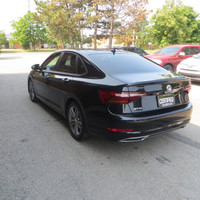 This 2019 Volkswagen Jetta is a stylish sedan with a sleek black exterior and dual tone black and pe... (image 8)
