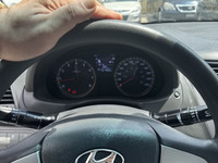 This 2014 Hyundai Accent Sedan is a reliable and stylish choice! With its sleek white exterior and c... (image 7)