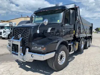 NEW VOLVO VHD84B dump truck in Black with matching Bibeau 21' x 48'' x 60'' black dump body. . Vehic...