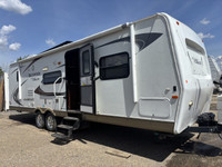 This 2011 travel trailer is waiting to be loved by it's new owners! The rear bathroom in this unit i... (image 1)