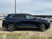 Under the glistening Rhapsody Blue exterior, the 2019 Lincoln Nautilus Reserve stands as a testament... (image 8)