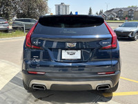 Finished in Twilight Blue Metallic and riding on stylish 18-inch aluminum wheels, this 2021 Cadillac... (image 6)