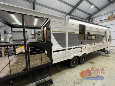 Forest River Wildwood X-Lite travel trailer 22VERANDA highlights: Rear Veranda/Porch Walk-Thru Bath...