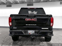 The 2021 GMC Sierra offers a rugged design with four-wheel drive, a tow hitch, and a locking rear di... (image 4)