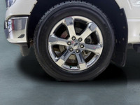The 2021 Ford F-150 Lariat, clad in a stunning white coat and equipped with a robust 4x4 drivetrain,... (image 8)