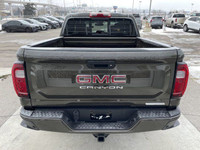 The 2024 GMC Canyon Elevation in Deep Bronze Metallic is a rugged and capable mid-size truck. Its bo... (image 6)