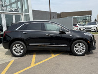 The 2024 Cadillac XT5 Luxury in Stellar Black Metallic combines refined styling with practical perfo... (image 8)