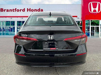 This 2022 Honda Civic Sedan LX boasts a sleek black exterior and a surprisingly spacious interior, p... (image 4)