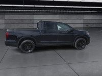 A rugged yet refined crew cab pickup with all-wheel drive and a 5.25 ft. box. The Black Edition incl... (image 8)