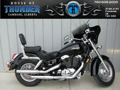 The 2006 Honda Shadow Sabre 1100 is a mid-sized cruiser motorcycle designed to blend classic America...