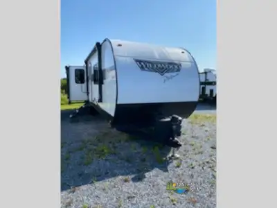 Forest River Wildwood travel trailer 32RET highlights: Opposing Slides Two Lounge Chairs Spacious Be...