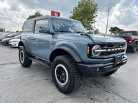 This 2023 Ford Bronco Outer Banks is a head-turner, boasting a Velocity Blue Metallic exterior and a... (image 2)