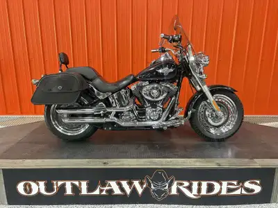 This beautiful 2012 Fatboy is the perfect cruiser! The wide tires make it stable at lower speeds and...