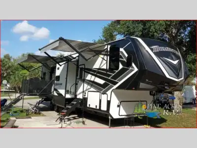 Grand Design Momentum fifth wheel toy hauler 399TH-R highlights: Fold-Down Side Patio 3 roof mounted...
