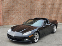 This isn’t just a car—it’s a statement. Draped in sleek black-on-black with polished chrome wheels t... (image 1)