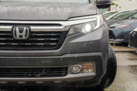 This 2019 Honda Ridgeline Touring brings together rugged capability, refined comfort, and advanced t... (image 7)