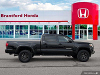 Conquer any terrain with this 2020 Toyota Tacoma Crew Cab Pickup, boasting a rugged Magnetic Grey Me... (image 6)