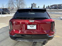 Finished in a head-turning Radiant Red Tricoat with a sleek Noir interior, the 2025 Cadillac Optiq E... (image 7)