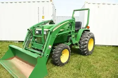 JOHN DEERE 790 TRACTOR. 4WD, JOHN DEERE 300 LOADER & BUCKET, ROLLBAR, FRONT GUARD, R-4 TIRES, 25X8.5...
