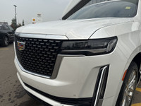 The 2022 Cadillac Escalade stands tall with commanding style and capability, finished in Crystal Whi... (image 2)