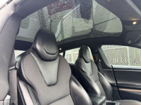 This sleek 2018 Tesla Model S in black is a stylish and eco-friendly choice for your next ride. With... (image 7)