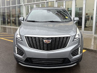 The 2023 Cadillac XT5, finished in a sleek Argent Silver Metallic paint, offers a confident all-whee... (image 1)