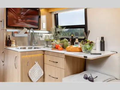 Leisure Travel Wonder Class B+ gas motorhome 24RTB highlights: Exterior Garage-Style Storage Rear Co...