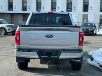 This 2023 Ford F-150 XLT has an Iconic Sliver Metallic exterior and Black Sport cloth seats with sea... (image 4)