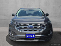 This 2024 Ford Edge Titanium AWD, presented in a sophisticated *Gray* finish, offers a compelling bl... (image 9)