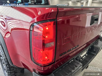 Get behind the wheel in our used 2021 Chevrolet Colorado ZR2 Crew Cab short box 4X4 in Cherry Red Ti... (image 9)