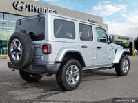 This 2023 Jeep Wrangler Sahara, a head-turner in Silver Zynith, offers both rugged capability and re... (image 4)