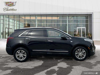 The 2023 Cadillac XT5 includes a hands-free liftgate, panoramic roof, heated front seats, and leathe... (image 5)