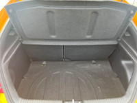 This 2016 Hyundai Veloster has a Yellow exterior and Grey seats with seating for 4. Equipped with a... (image 5)