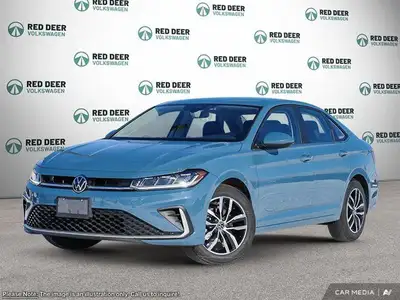 The 2025 Volkswagen Jetta Comfortline is a stunning blue sedan that offers a smooth driving experien...