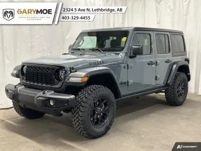 The 2025 Jeep Wrangler 4-Door Willys in stunning gray with 44 drive is a vehicle designed to conquer...