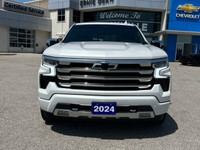 The Chevrolet Silverado 1500 High Country in pristine white with a robust 4×4 drivetrain ensures exc... (image 1)