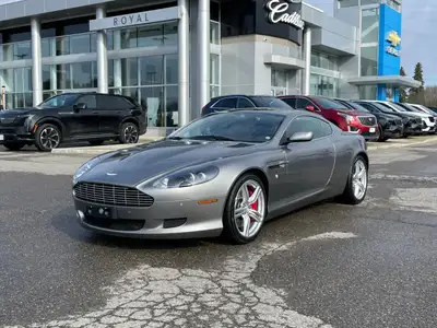 Experience luxury and performance with our exquisite Silver Aston Martin DB9 2dr Coupe Automatic. De...