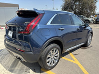 Finished in Twilight Blue Metallic and riding on stylish 18-inch aluminum wheels, this 2021 Cadillac... (image 7)