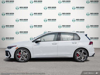 The 2025 Volkswagen Golf GTI in a striking white finish is a front-wheel-drive dynamo engineered to... (image 2)