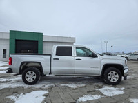 2018 GMC Sierra 1500 4WD Crew Cab SLE with a 5.3L. This truck is equipped with power drivers front s... (image 3)