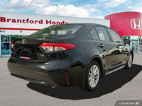 This sleek 2022 Toyota Corolla LE sedan in Black Sand Pearl is ready to enhance your daily commute.... (image 5)