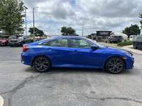 This Aegean Blue Metallic 2021 Honda Civic Sedan Sport is a head-turner. Boasting a low 39,352 kilom... (image 3)