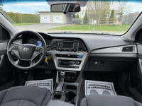 This 2016 Hyundai Sonata is a reliable sedan with a sleek gray exterior and a spacious interior in a... (image 9)