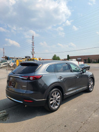 This 2022 Mazda CX-9 Grand Touring AWD is a sleek and spacious SUV that's perfect for your family ad... (image 3)