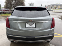 The 2023 Cadillac XT5, finished in a sleek Argent Silver Metallic paint, offers a confident all-whee... (image 6)